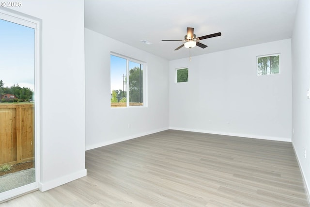 964 NE 14th St, Battle Ground, WA 98604 - empty room with light wood finished floors, ceiling fan, and baseboards