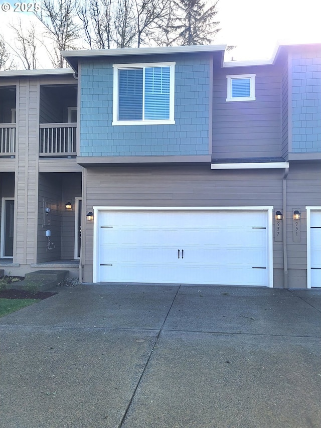 view of front of property with a garage and driveway