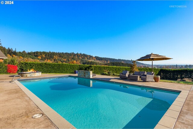 2945 SW Homesteader Rd, West Linn, OR 97068 - view of pool featuring a patio area, an outdoor living space, and a wooded view