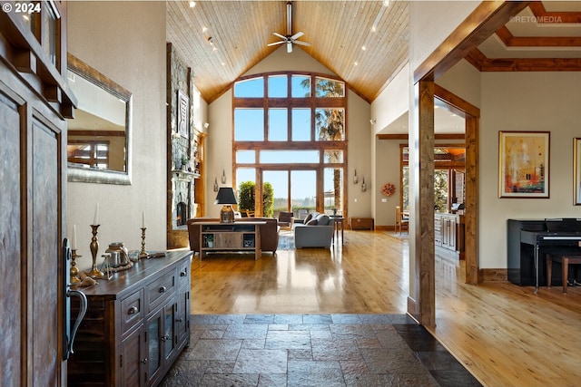 2945 SW Homesteader Rd, West Linn, OR 97068 - foyer entrance with high vaulted ceiling, ceiling fan, dark wood-type flooring, wood ceiling, and baseboards