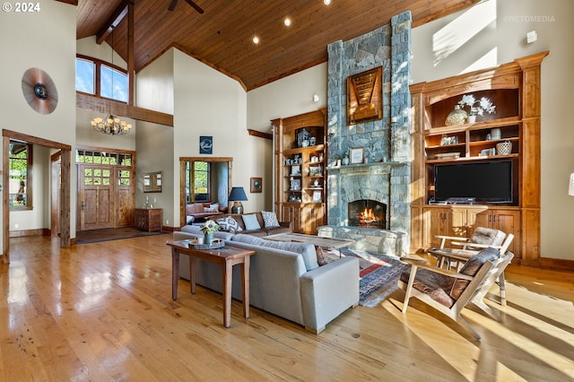 2945 SW Homesteader Rd, West Linn, OR 97068 - living room with wooden ceiling, high vaulted ceiling, a chandelier, a stone fireplace, and wood finished floors