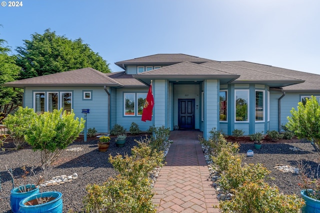 view of front of home featuring roof with shingles