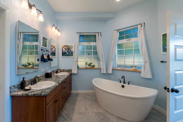 bathroom with vanity and a bathtub