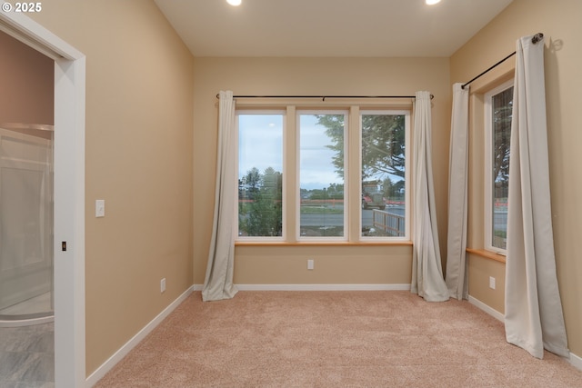 carpeted spare room with recessed lighting and baseboards