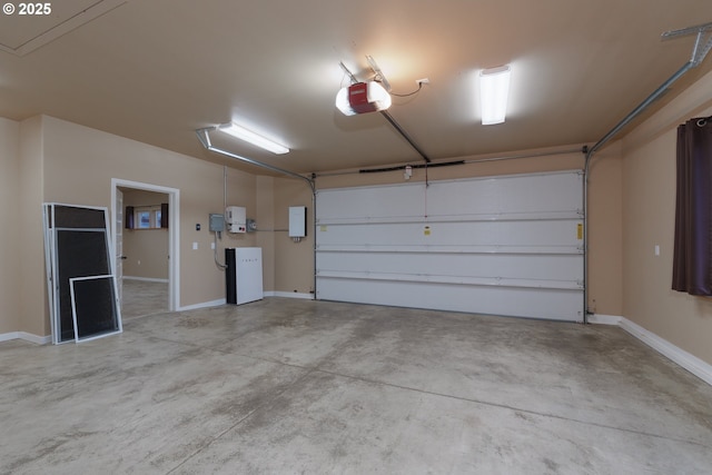 garage featuring baseboards and a garage door opener