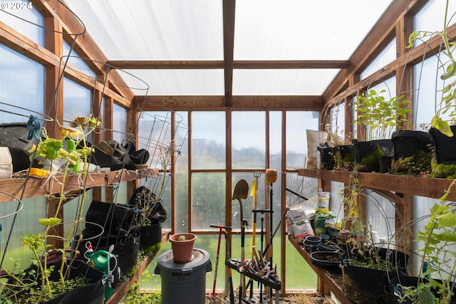 sunroom / solarium featuring vaulted ceiling