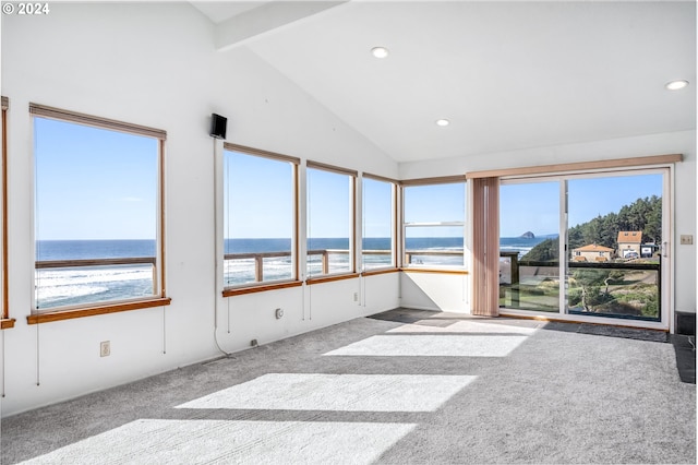 unfurnished sunroom featuring a water view and lofted ceiling with beams