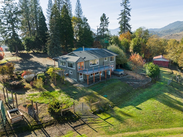 birds eye view of property featuring a mountain view