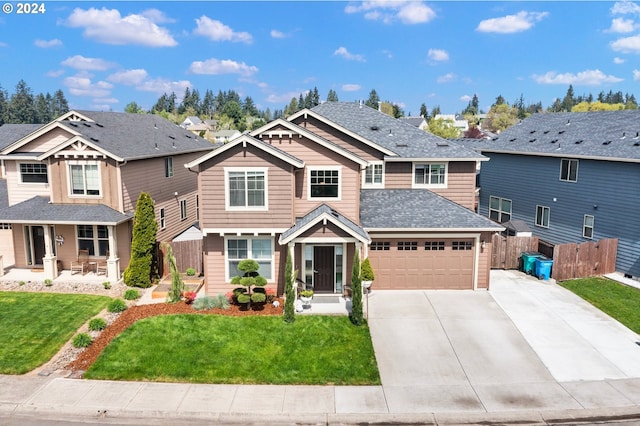 craftsman inspired home featuring a front lawn