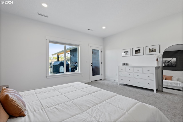 bedroom featuring light carpet