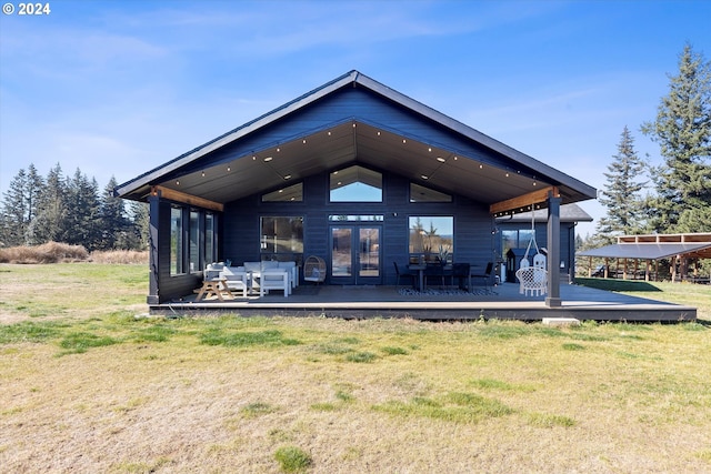 back of house featuring an outdoor hangout area, a lawn, and a wooden deck