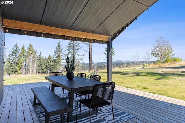 wooden deck featuring a yard