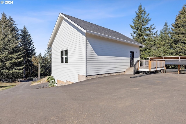 view of side of home featuring a deck