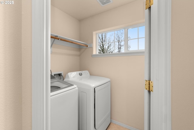 washroom featuring separate washer and dryer