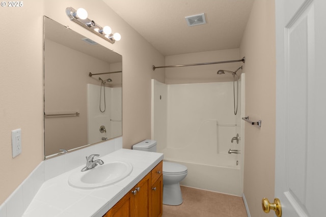 full bathroom with toilet, tub / shower combination, vanity, tile patterned floors, and a textured ceiling