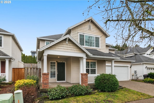 view of front of home with covered porch and a garage