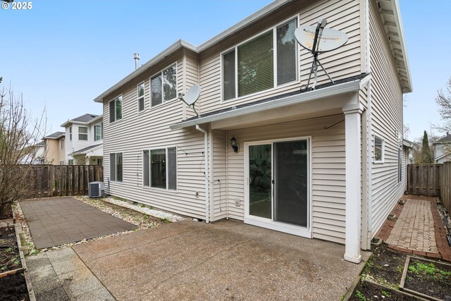 rear view of property with central AC and a patio area