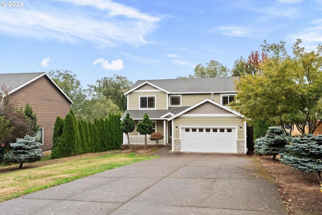 view of front of property with a front lawn and a garage