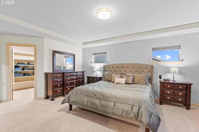 carpeted bedroom with a textured ceiling