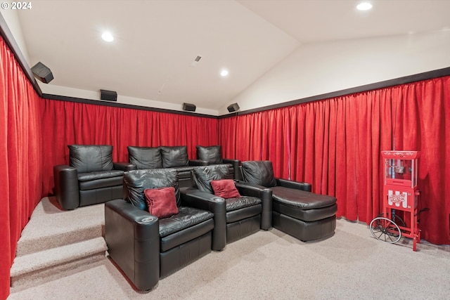 carpeted cinema room with lofted ceiling