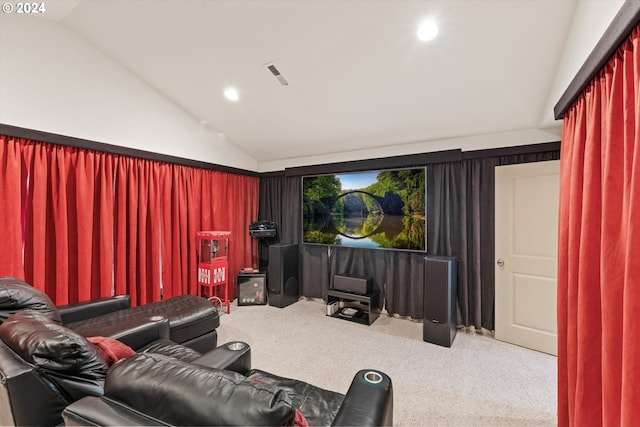 cinema room with carpet flooring and lofted ceiling