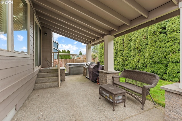 view of patio / terrace featuring a hot tub