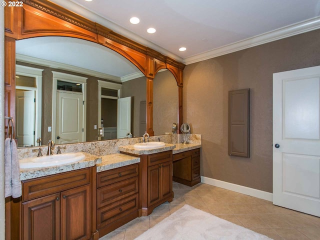 bathroom with tile patterned floors, ornamental molding, and vanity