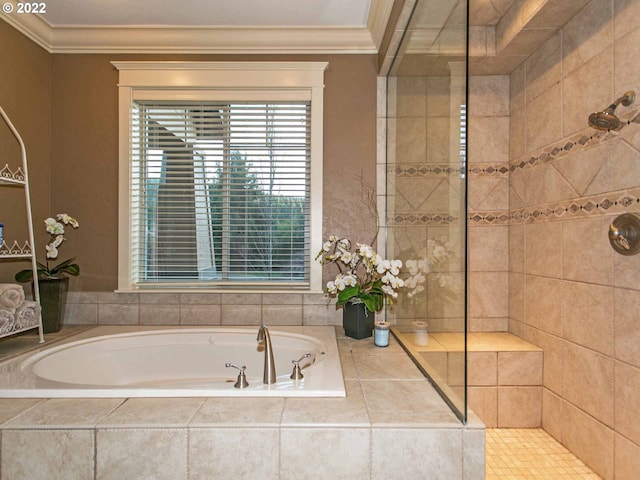 bathroom with crown molding and shower with separate bathtub