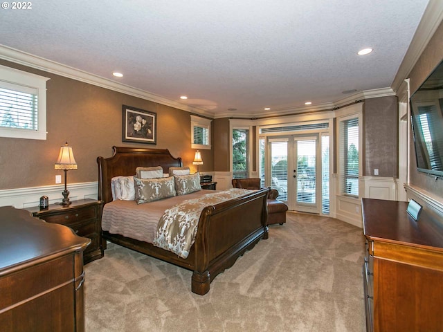 bedroom featuring crown molding, light colored carpet, and access to exterior