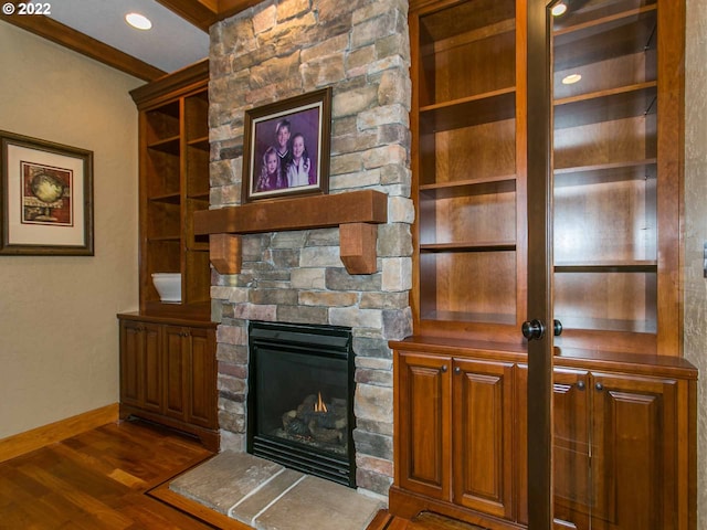 unfurnished living room with dark wood-type flooring and a fireplace