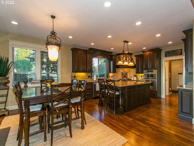 dining room with dark hardwood / wood-style floors