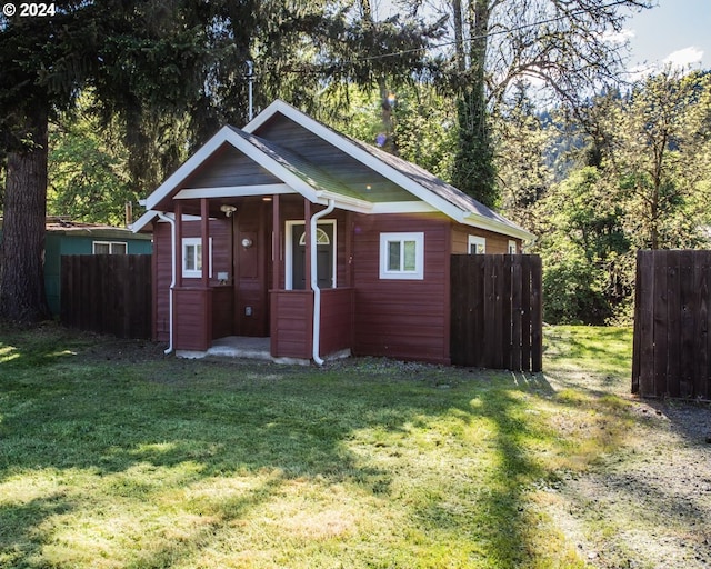 bungalow-style house with a front yard