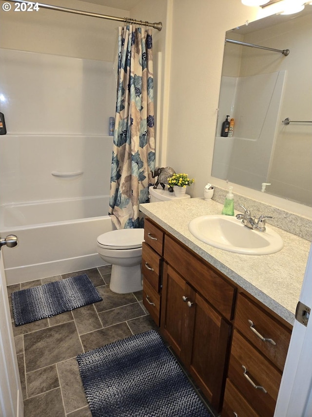 full bathroom featuring shower / bath combination with curtain, toilet, and vanity