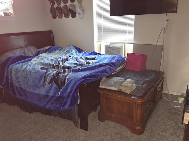 bedroom with carpet floors, multiple windows, and cooling unit