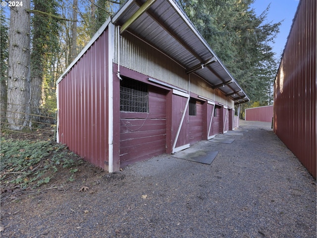 view of side of property featuring an outbuilding