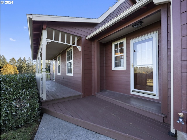 view of exterior entry with covered porch