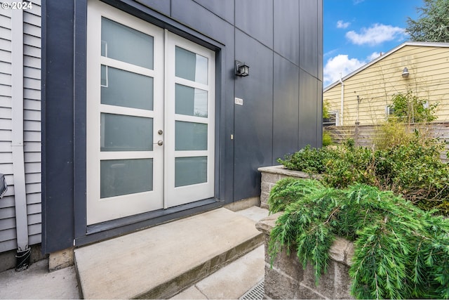 view of exterior entry featuring french doors