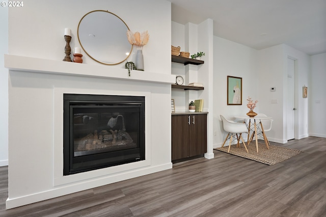 living room featuring dark wood-type flooring