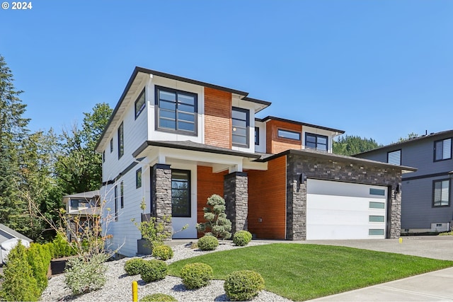 contemporary home with a front lawn