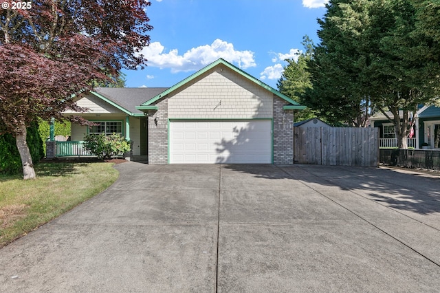 1157 Yew St, Junction City, OR 97448 - single story home featuring driveway, a garage, brick siding, and covered porch
