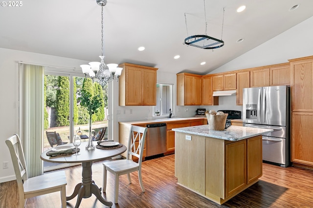1157 Yew St, Junction City, OR 97448 - kitchen featuring appliances with stainless steel finishes, a chandelier, lofted ceiling, a kitchen island, and a sink