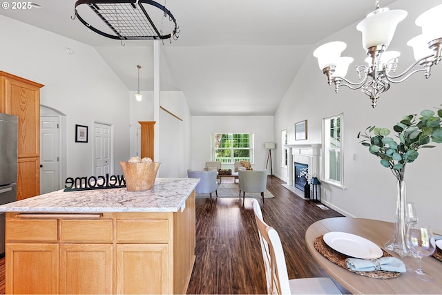 1157 Yew St, Junction City, OR 97448 - kitchen featuring high vaulted ceiling, dark wood-style flooring, a chandelier, open floor plan, and a center island