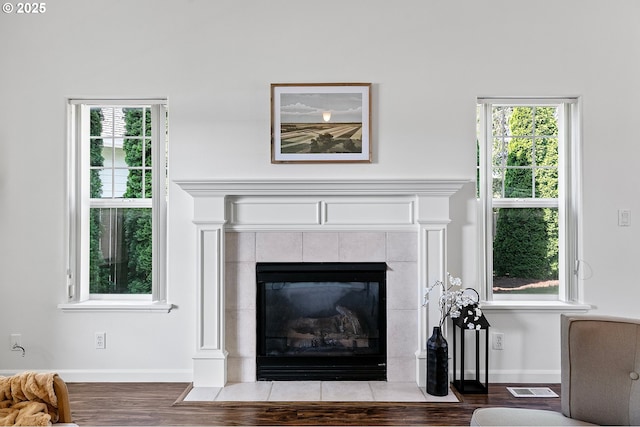 1157 Yew St, Junction City, OR 97448 - detailed view of wood finished floors, baseboards, and a tile fireplace