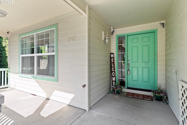 1157 Yew St, Junction City, OR 97448 - doorway to property with covered porch and a surveillance system