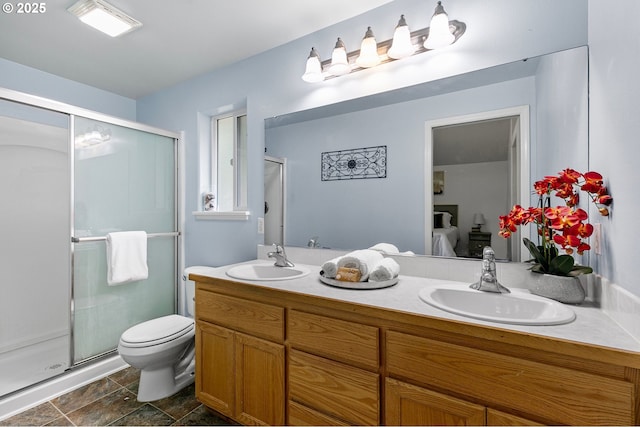 1157 Yew St, Junction City, OR 97448 - bathroom with double vanity, a shower stall, toilet, and stone finish floors