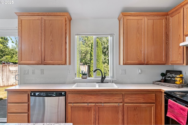 1157 Yew St, Junction City, OR 97448 - kitchen with stainless steel dishwasher, a sink, light countertops, and plenty of natural light