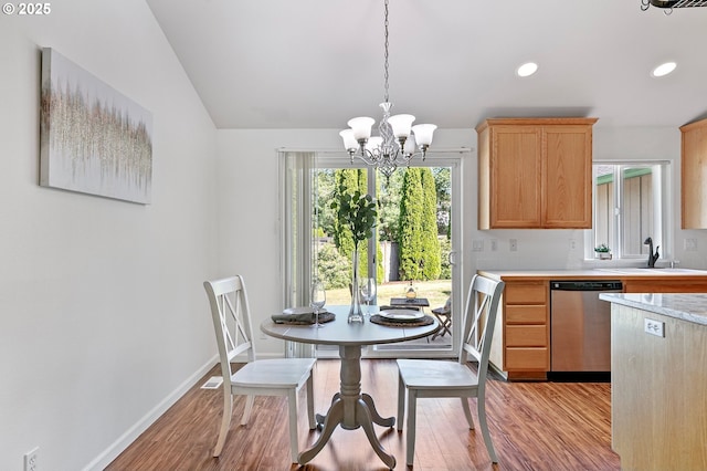 1157 Yew St, Junction City, OR 97448 - dining room featuring light wood-style floors, a chandelier, recessed lighting, baseboards, and lofted ceiling