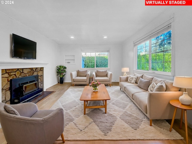 living room with light hardwood / wood-style flooring