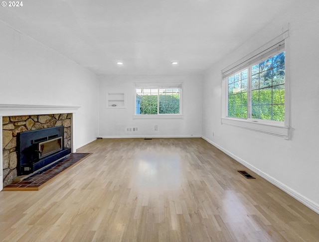 unfurnished living room with light hardwood / wood-style floors