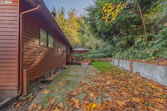 view of side of property featuring a gazebo